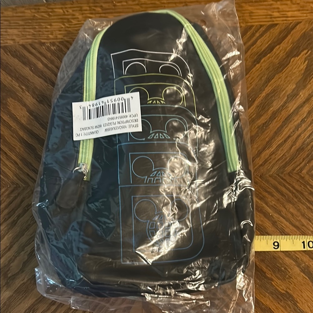 Stylish Black Backpack with Green Accents.  Walt Disney World Sling Bag